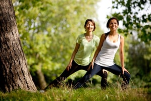 2 woman stretching 